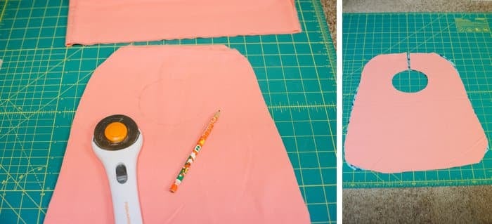Cutting fabric for a bib for baby.