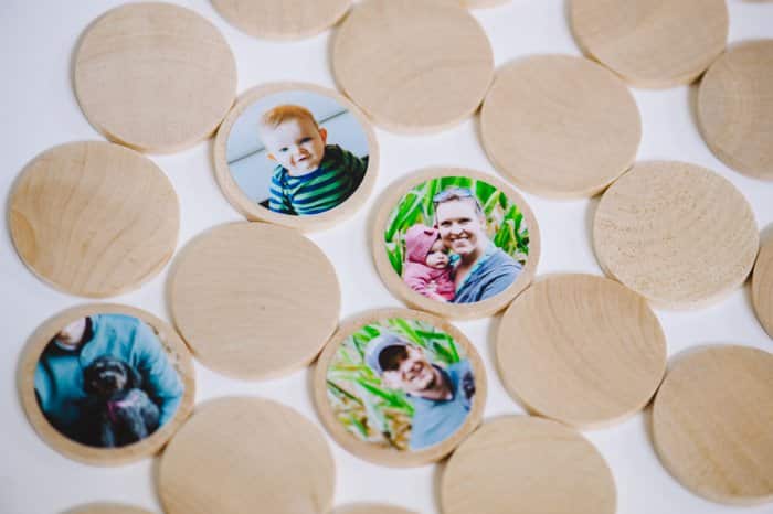 A DIY memory match game made with wooden circle discs and photos attached with Mod Podge.