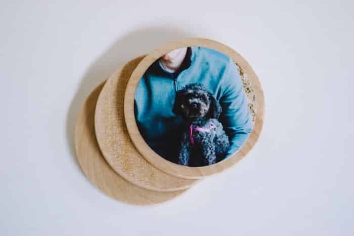 Circles of wood with photos Mod Podged to them.