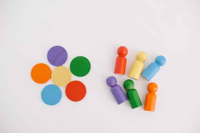 Rainbow peg people and wooden circles