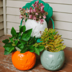 Cheap DIY Fall Porch Decor Idea - Painted $1 Plastic Pumpkins | One dollar Target Plastic Treat Buckets DIY Decorations