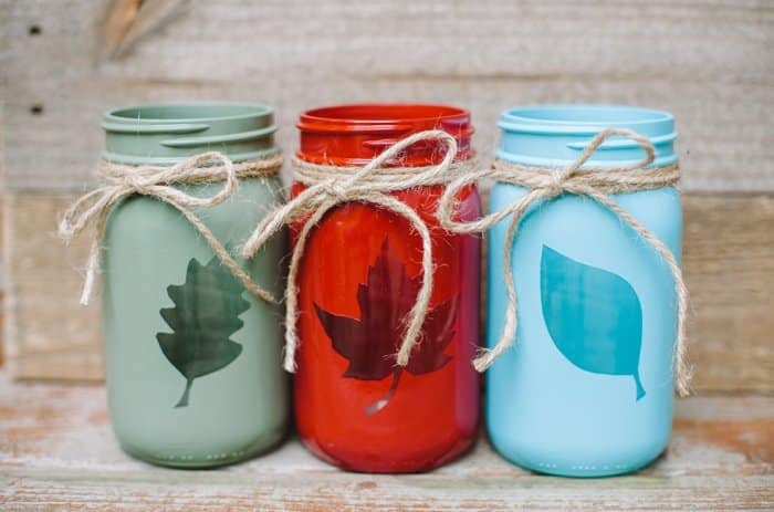 Fall mason jar craft idea with vinyl leaf cut outs and twine