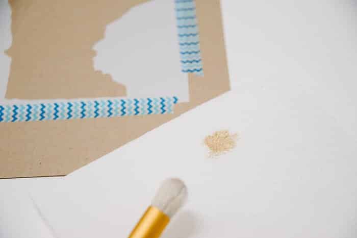 Remove excess paint from stencil brush