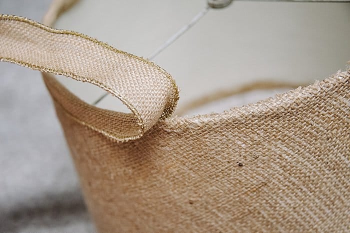 Use burlap ribbon to finish the edges of a diy lampshade makeover