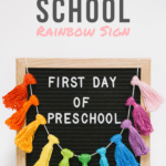 A Showstopper_ First Day of School Sign with a Rainbow Tassel Garland
