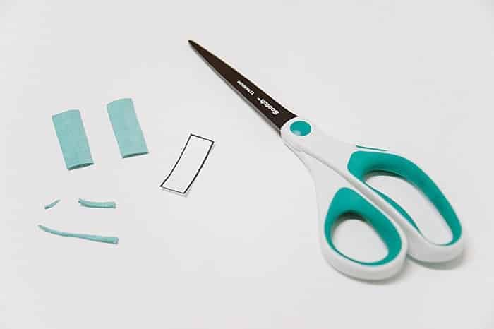 Earring templates and cutting out leather shapes to make earrings.
