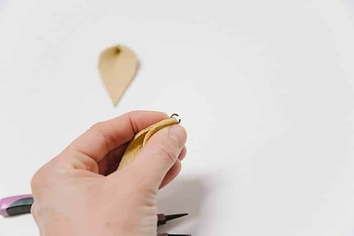 Use metal jump ring to close leaf shaped earring.