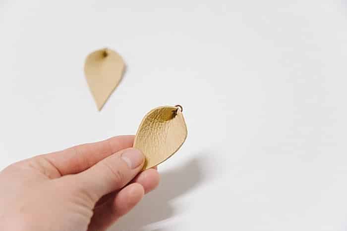 Pinch jump ring closed with pliers.
