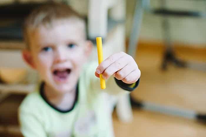 take wrapper off crayons to use in leaf rubbing