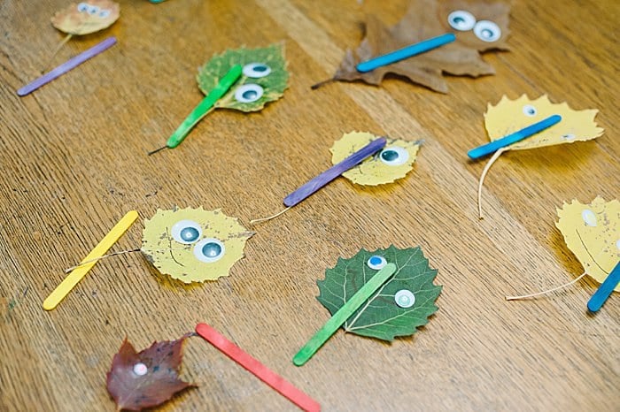 use popsicle sticks to turn leaves into leaf monsters