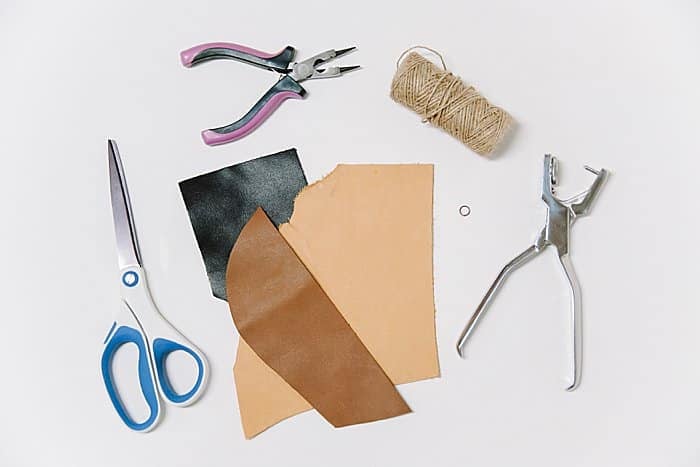 Supplies to make a DIY leather scrap Christmas ornament