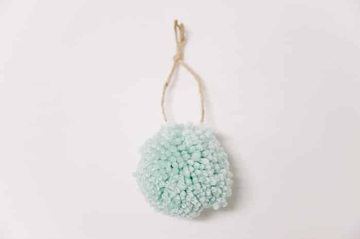 How to make a yarn pom pom ornament with a pom pom maker.