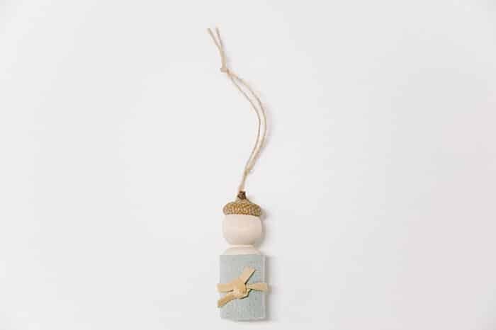 How to make a peg doll craft and acorn ornament combining them into a waldorf inspired peg doll ornament for Christmas