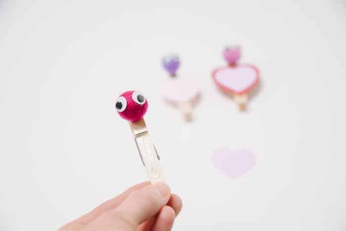 How to Make Valentine's Day Treat Buddies | Hot glue card stock heard onto clothes pin