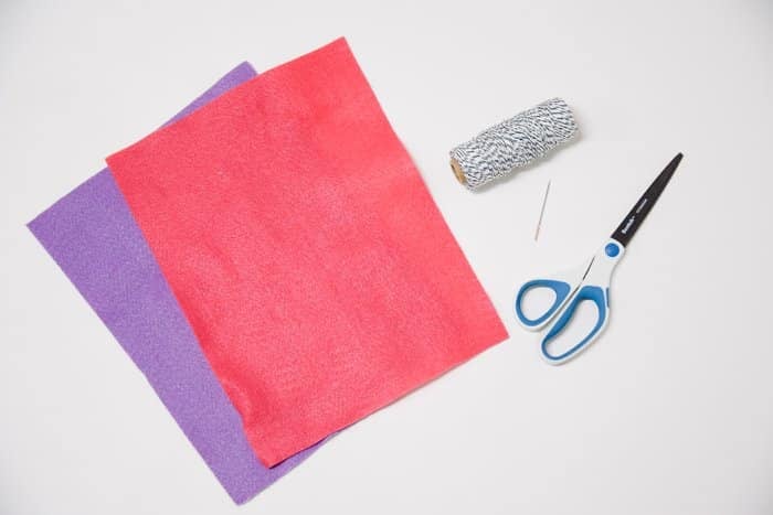 Supplies to make a felt heart treat pouch.