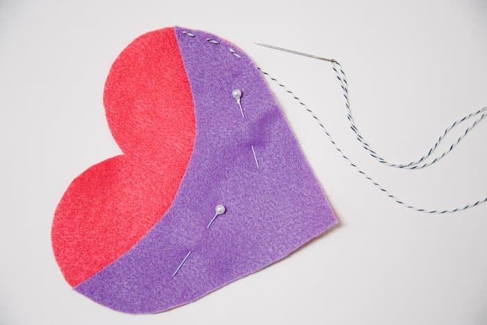 Pin the felt hearts together so you can sew around the outside edge.