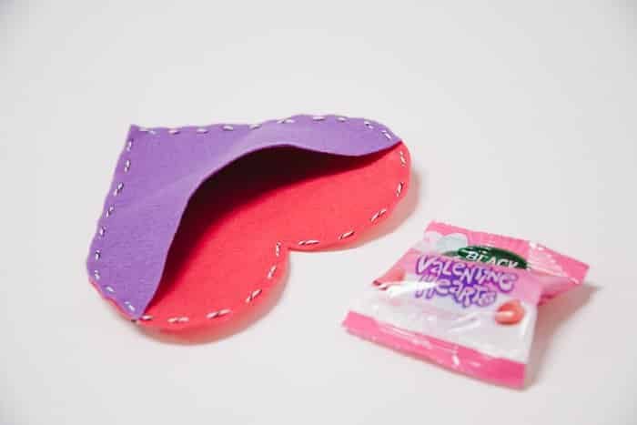 A felt heart treat pouch, ready to slide a treat inside.