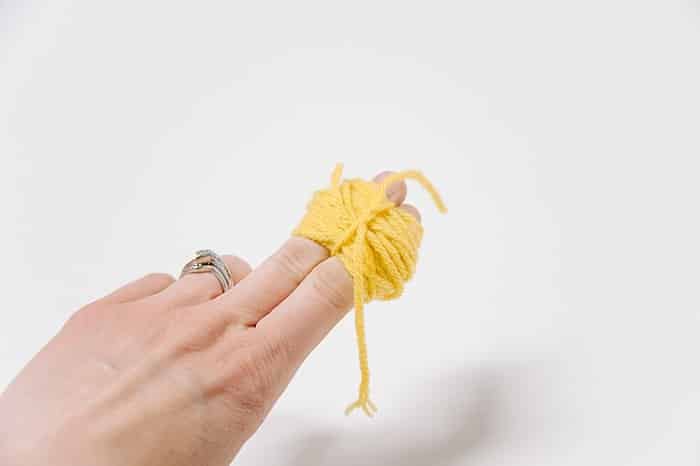 How to Make Yarn Pom Poms By Hand, Without a Pom Pom Maker