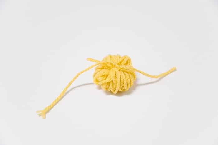 How to Make Yarn Pom Poms By Hand, Without a Pom Pom Maker