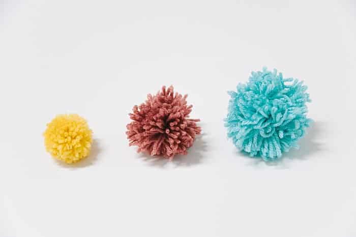 How to Make Yarn Pom Poms By Hand, Without a Pom Pom Maker