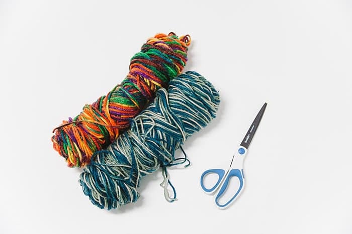 multi-colored yarn to make diy pom poms