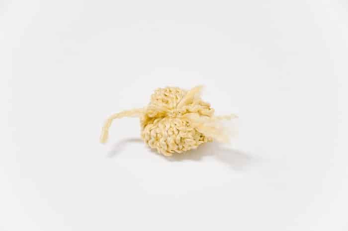 making a pom pom with fuzzy yarn