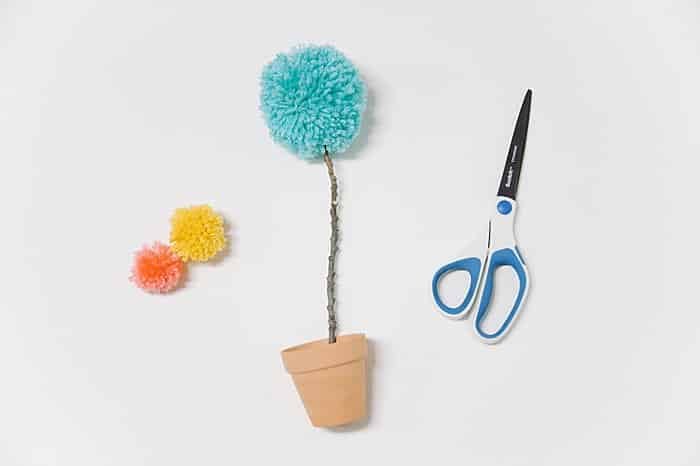 making a flower from a pom pom