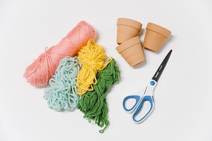 Supplies needed to make diy faux cactus plants in pots.