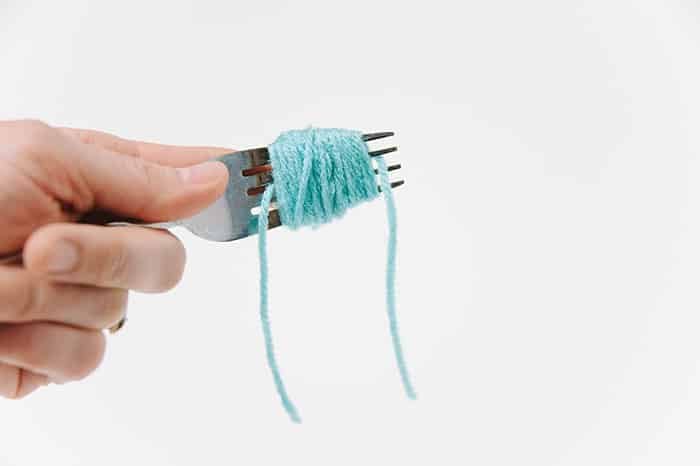 diy pom pom using fork