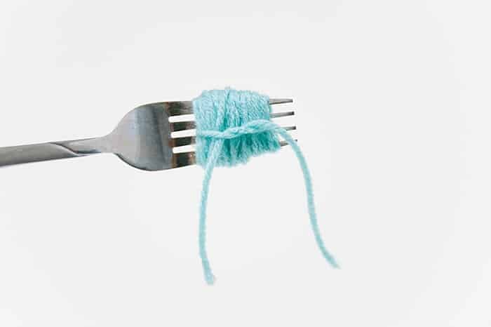 diy pom pom with a fork step by step