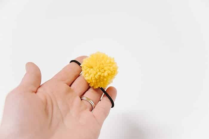 diy hair tie with a pom pom on it