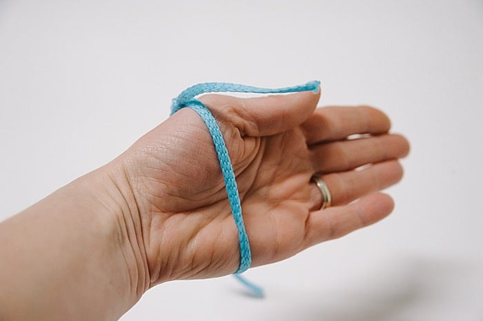 fit your sliding knot bracelet over the biggest part of your wrist before you tie the second knot