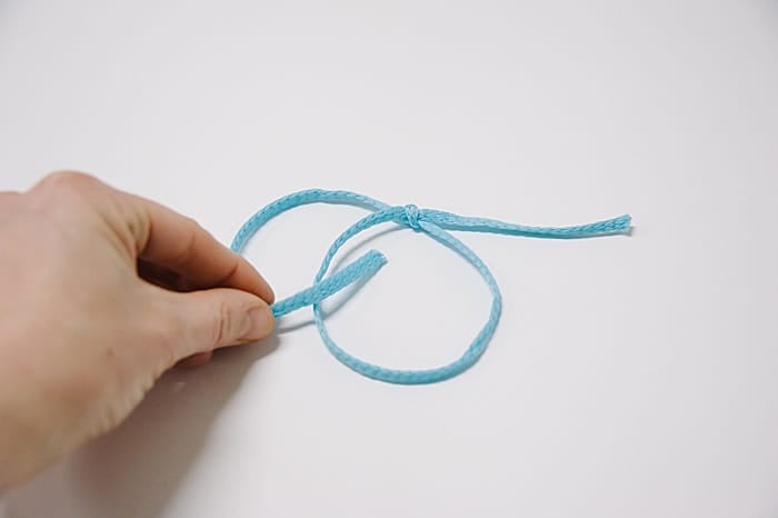 tie a second sliding knot onto your sliding knot bracelet