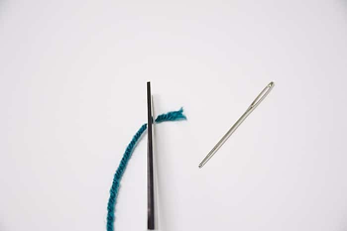 Cut off the frayed end of your string before threading your needle.