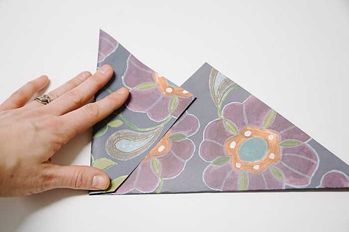 fold in left side of paper square to make an envelope