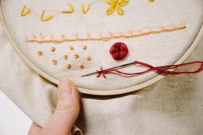 woven wheel stitch for embroidery looks like a rose
