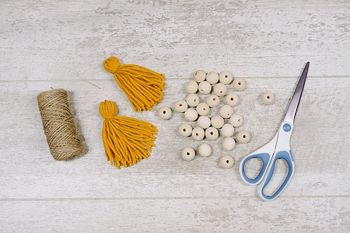 how to make a wood bead garland with tassel ends