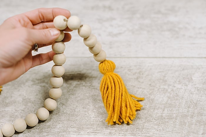 twine is hidden inside the wooden beads of the garland