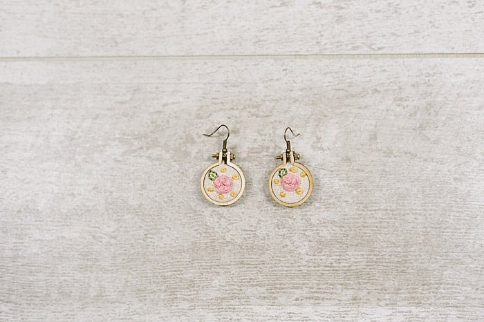 Mini embroidery hoop earrings with earring hooks.