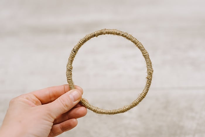 wrap twine around the entire metal hoop