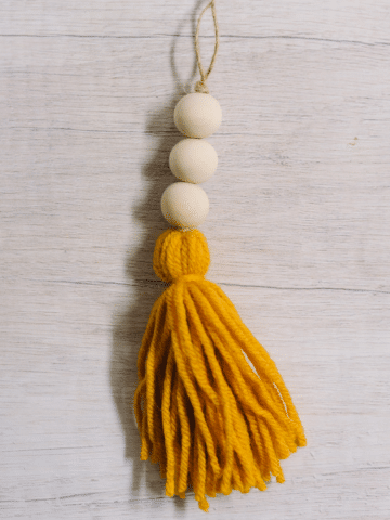 how to make a yarn tassel and wooden bead ornament