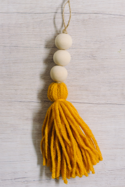 how to make a yarn tassel and wooden bead ornament