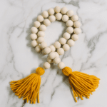 How to Make a Wood Bead Garland with Yarn Tassels