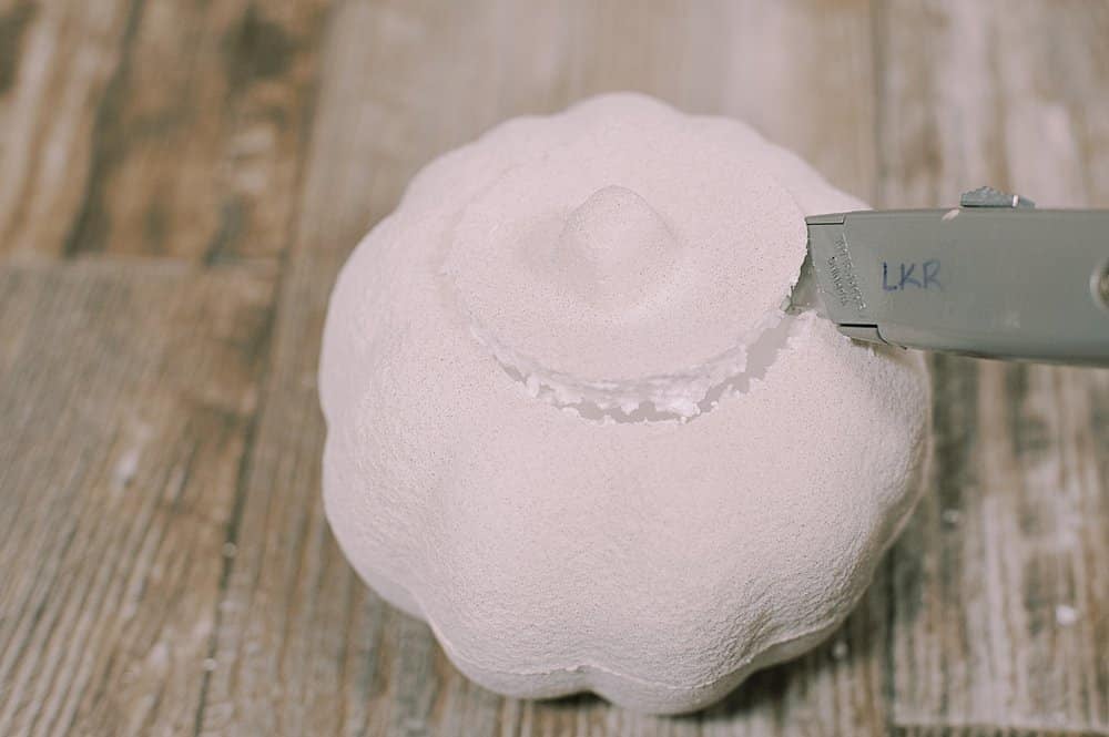 cut top off styrofoam pumpkin with utility knife