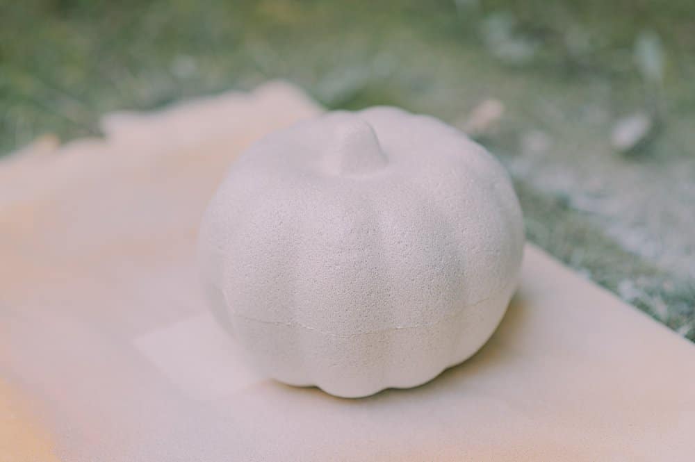 styrofoam pumpkin from dollar tree painted with textured spray paint