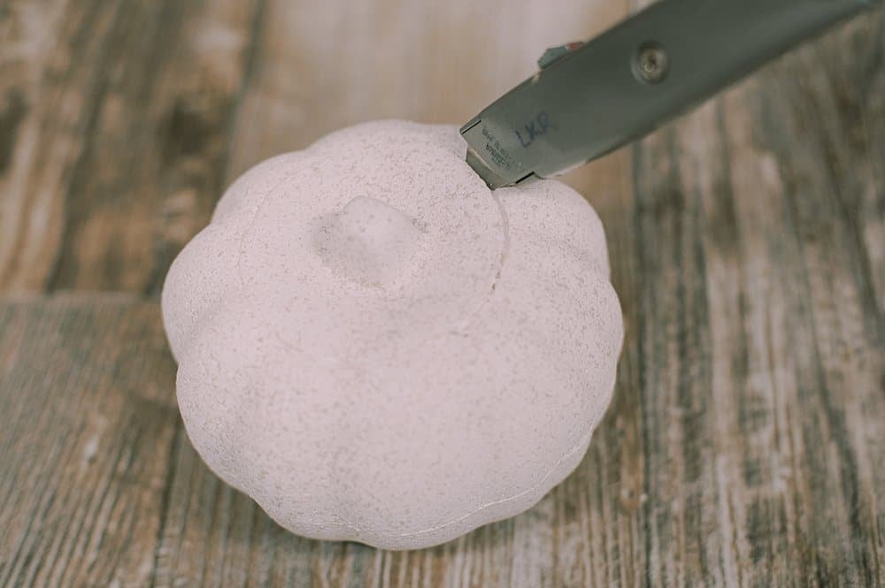 cut the top off a styrofoam pumpkin using a utility knife