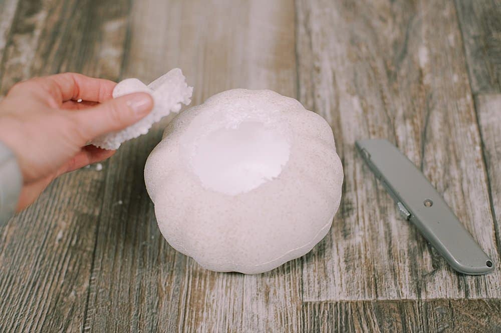 the top of the styrofoam pumpkin comes out easily with a utility knife