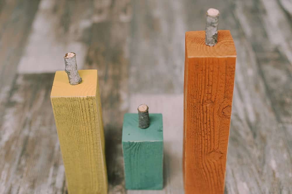 Wooden blocks with wooden stems hot glued on the top