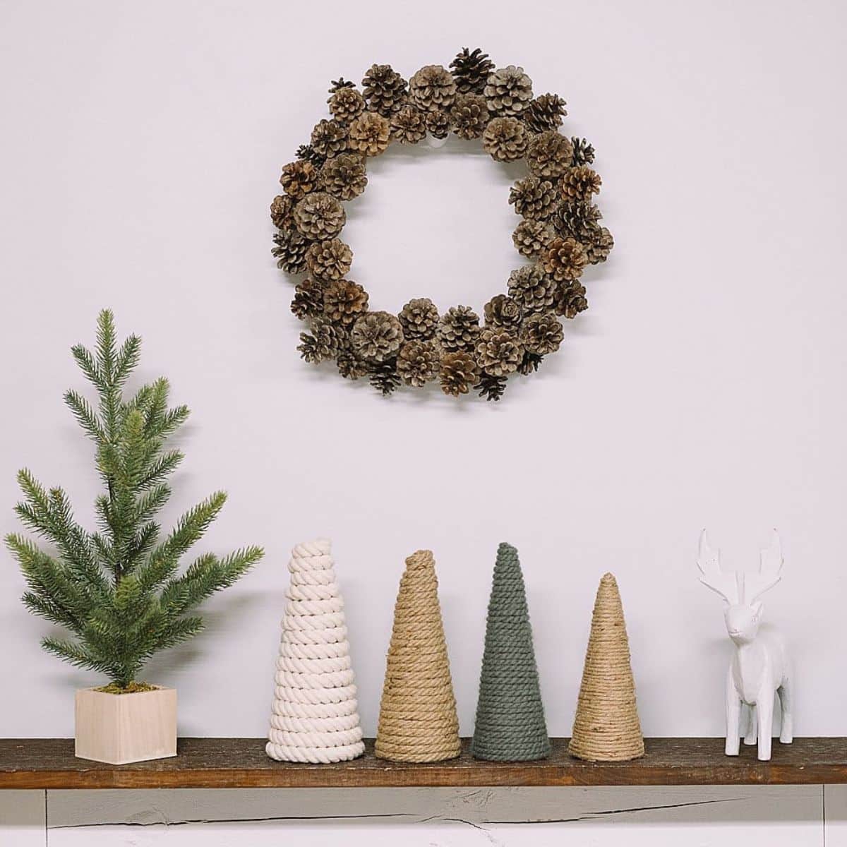How to make DIY Christmas Trees using cones wrapped with rope, yarn, or jute.