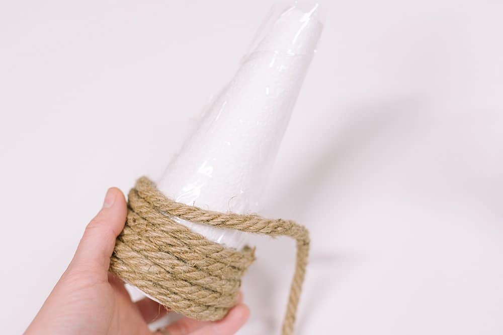 Glue and wrap the jute around the cone from the base up.